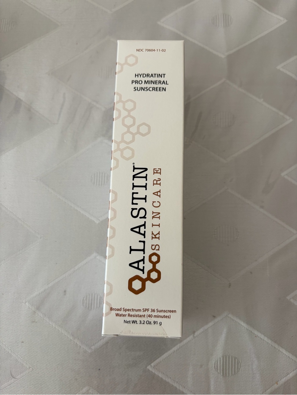 Alastin Hydratint Pro Mineral Sunscreen - White with Bronze Accents